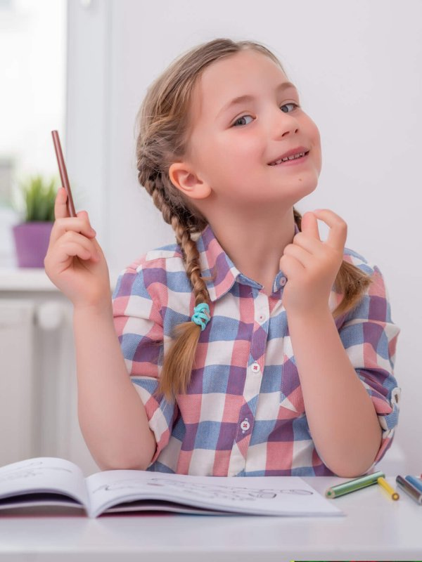 little girl playing school at home
